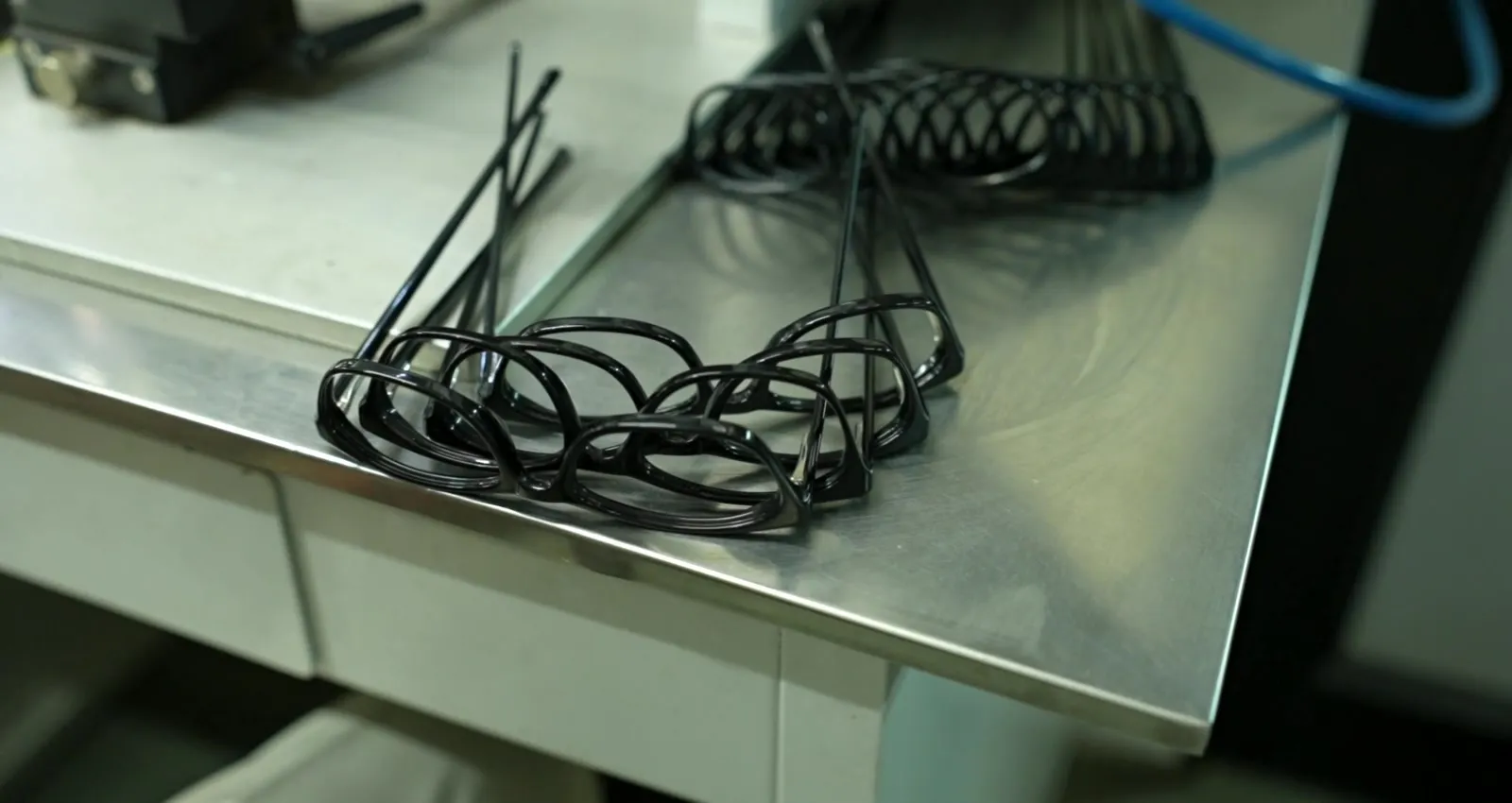 Precision stainless steel core wires ready for insertion into acetate temples
