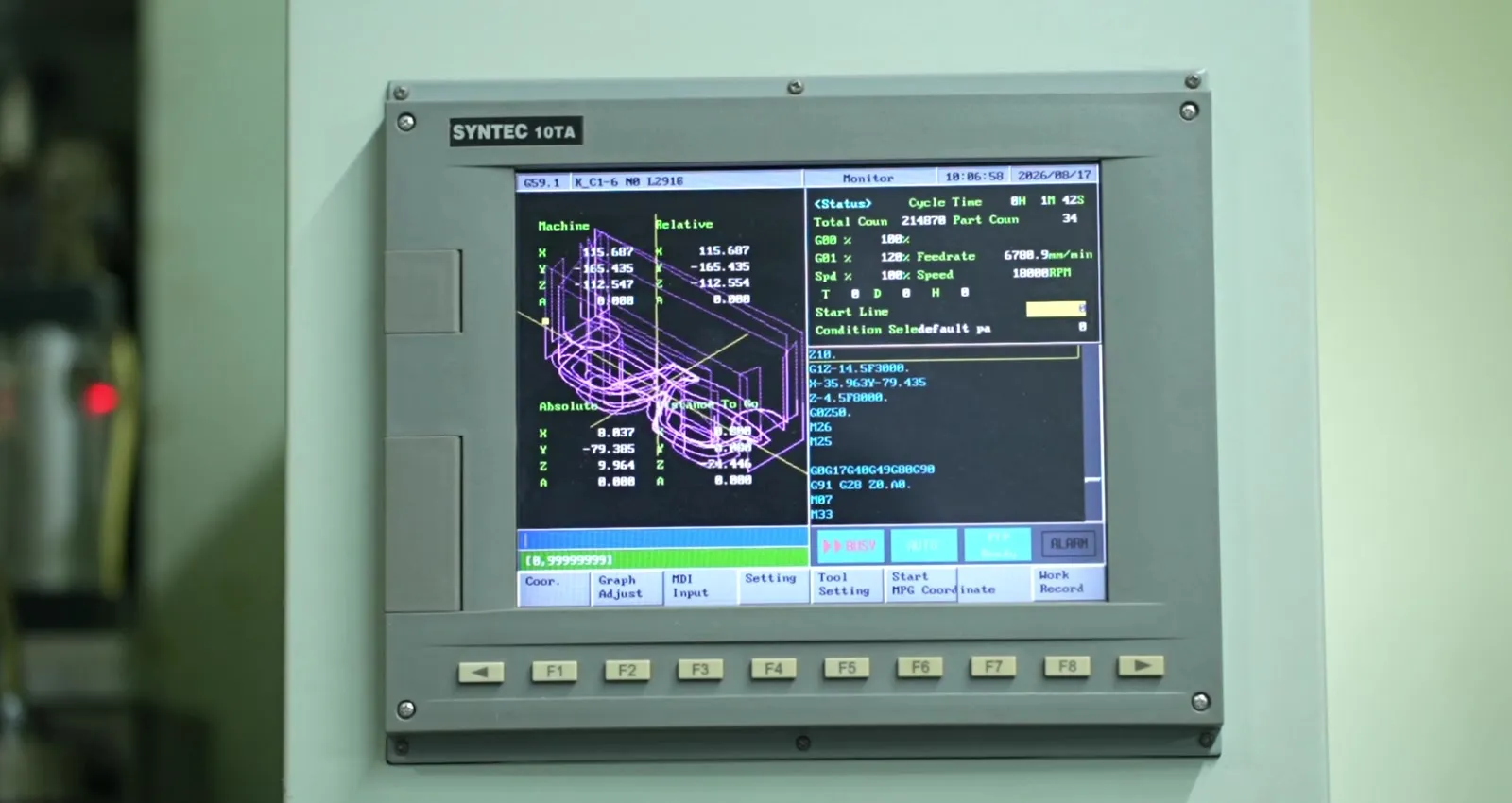 CNC machine controller displaying toolpath coordinates for optical frame fronts