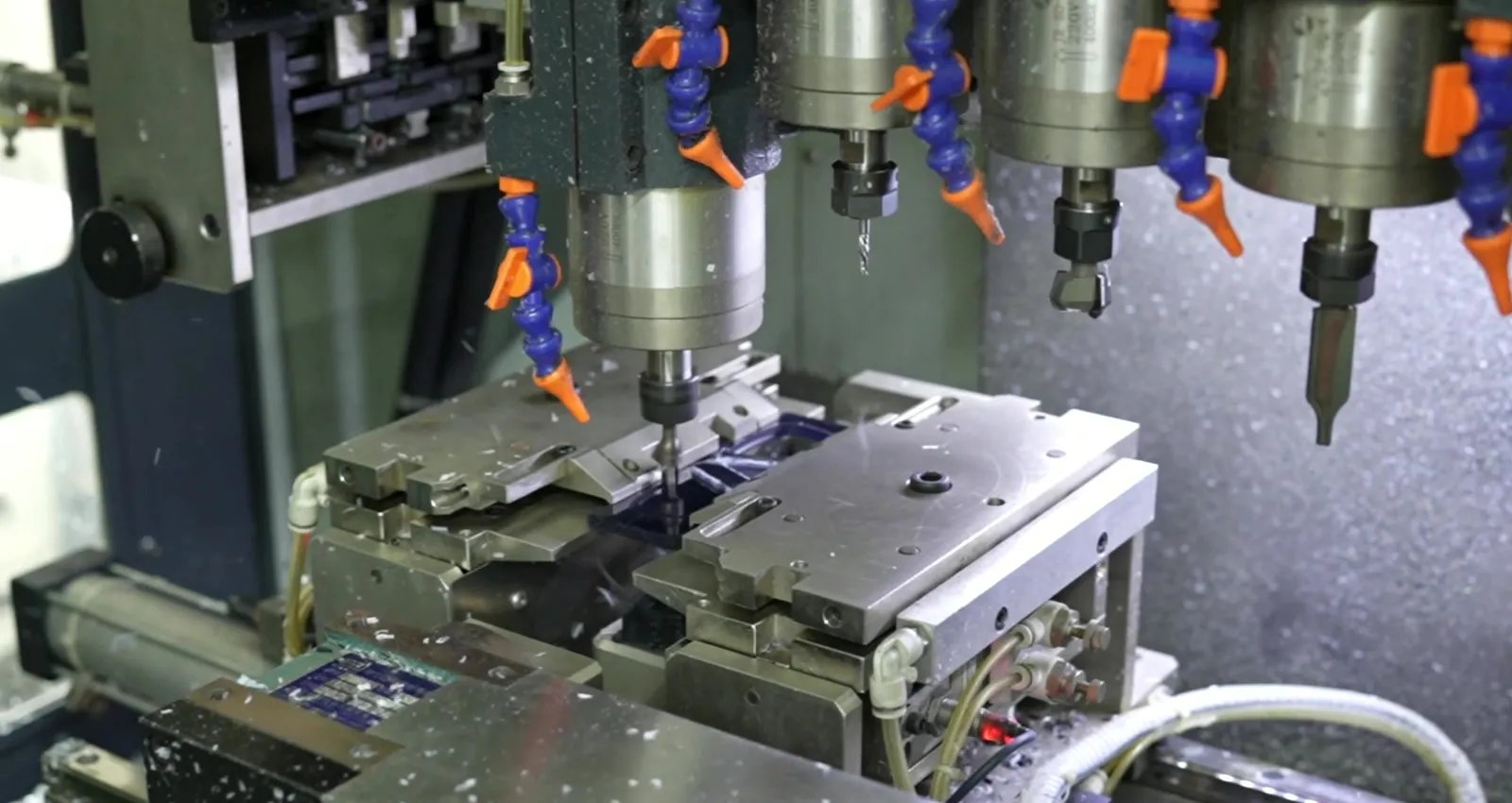 Multi-spindle CNC milling acetate frame fronts under controlled coolant